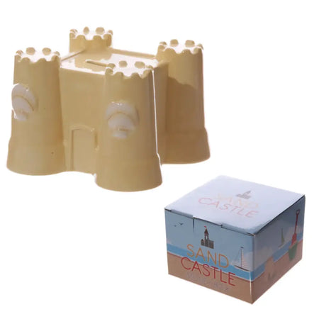 Beige ceramic sand castle money box with molded towers and coin slot for saving coins and small change