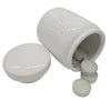 White ceramic storage jar with embossed text holding small silver tea light candles and wax melts