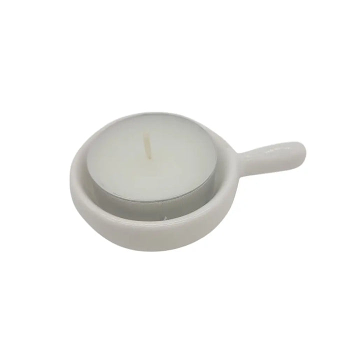 White ceramic tealight spoon candle holder with small handle designed for a single tealight candle use