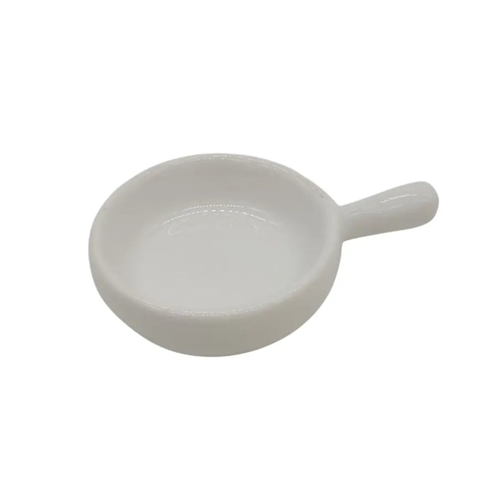 White ceramic tealight spoon with a glossy finish and small handle for holding and lighting tealights