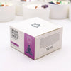White and purple chakra crystal candle box with a meditating figure for crown chakra spiritual connection