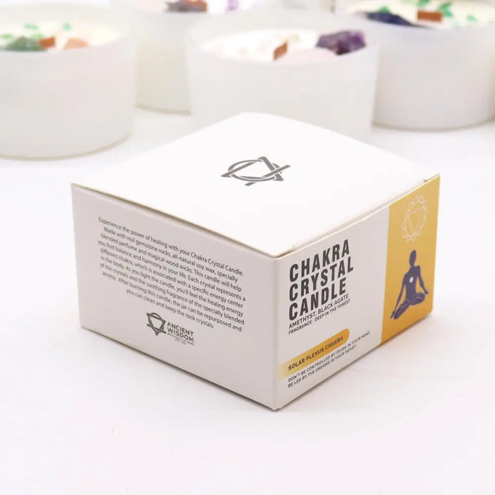 White cardboard box for chakra crystal candle with black yellow branding for solar plexus chakra deep forest scent