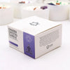 White cardboard box with purple accents labeled chakra crystal candle by ancient wisdom for third eye chakra use