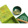 Green chakra singing bowl with gold geometric design made for heart chakra meditation and healing practice
