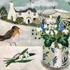 A white ceramic vase with blue leaf patterns holds white and blue flowers for snowy owl christmas cards by sarah bowman
