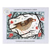 A christmas card pack featuring a brown song thrush on branches with red berries and a snowy starry background