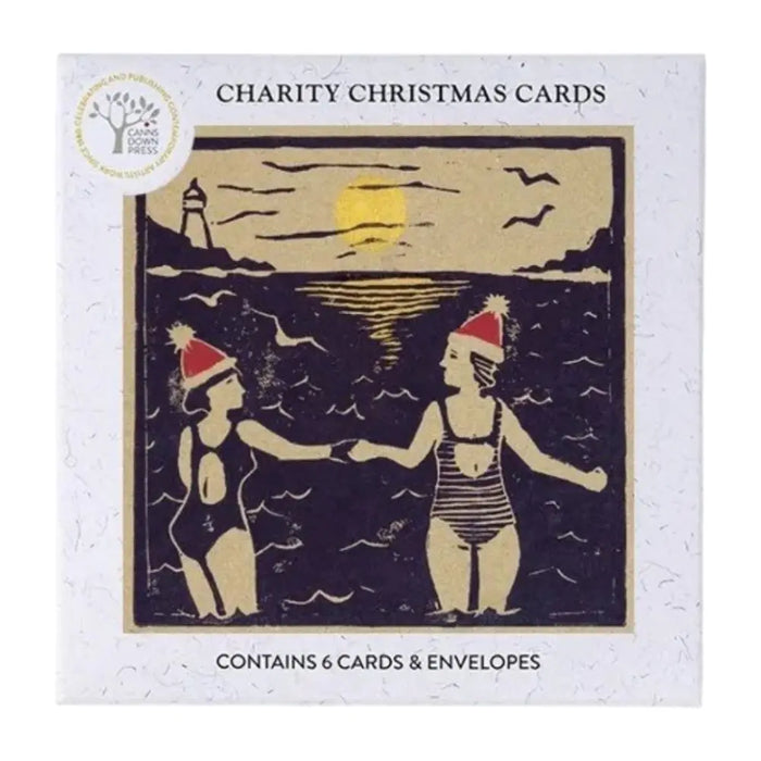 Square charity christmas card pack by bronwen tyrrell with vintage women in santa hats by seaside lighthouse at sunset