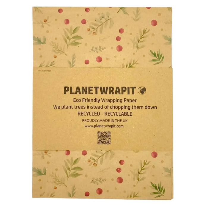 Beige recycled kraft wrapping paper with green leaf and red berry botanical pattern folded as a gift sheet