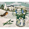 A white ceramic mug with blue leaf pattern holds white and blue flowers alongside christmas cards by sarah bowman featuring snowy owl