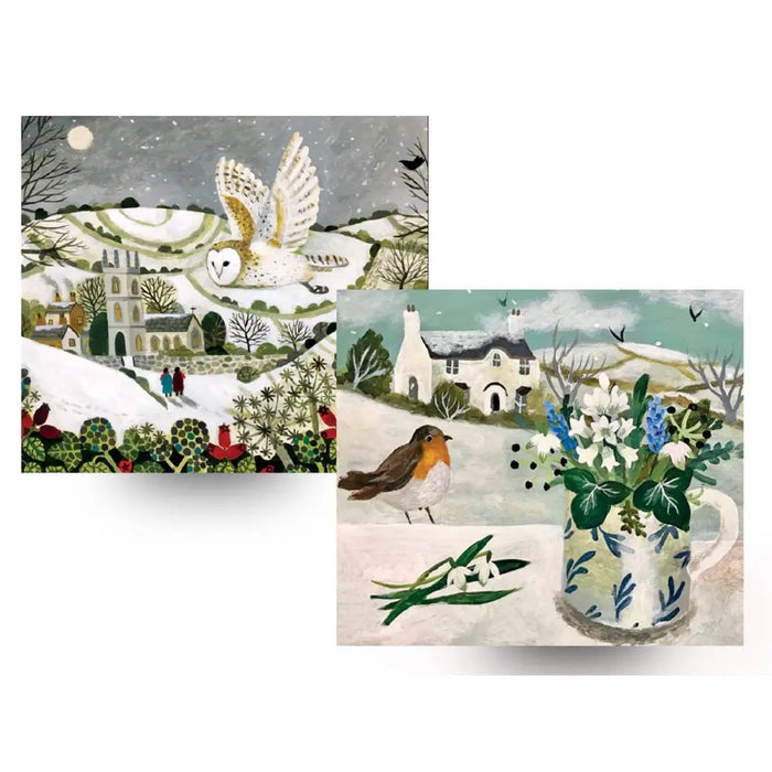 White ceramic mug with blue leaf pattern holding white and blue flowers alongside sarah bowman christmas cards with snowy owl