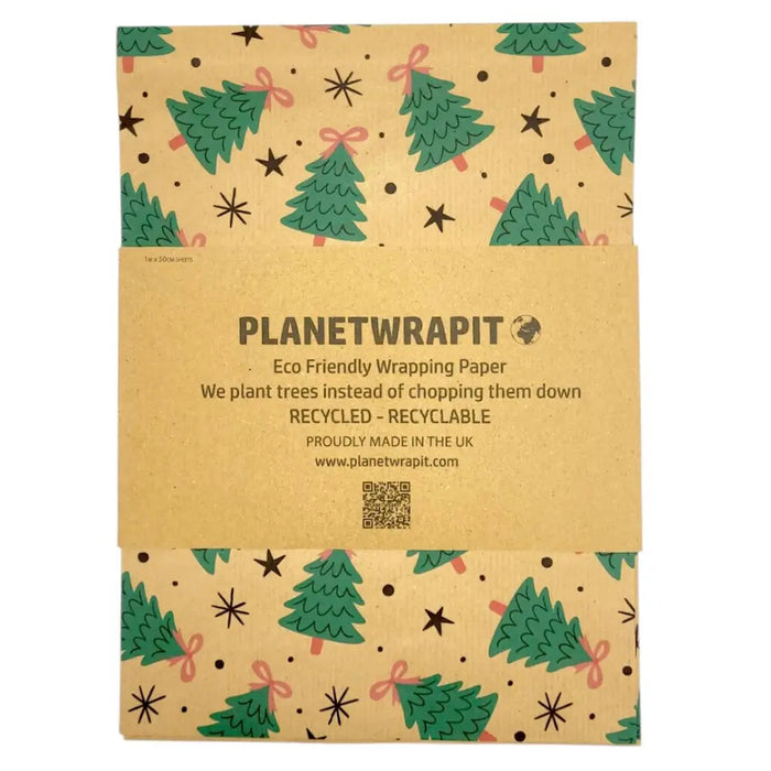 Brown recycled kraft wrapping paper with green christmas trees pink bows and black stars on kraft paper sheet