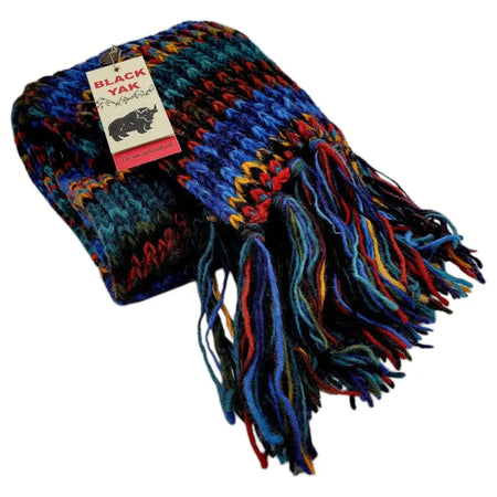 Chunky hand-knit wool scarf with fair trade electric blue red and yellow stripes and long multicolored fringe ends