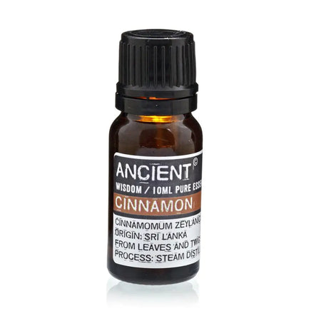 A small amber glass bottle with black cap labeled ancient wisdom 10ml pure cinnamon essential oil cinnamomum zeylanicum