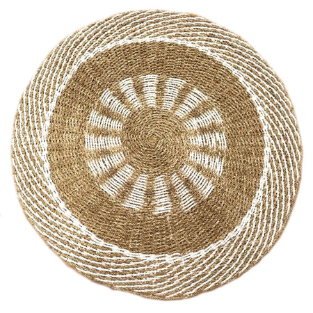 Circular seagrass rug with natural beige and white striped pattern in concentric rings woven from seagrass material