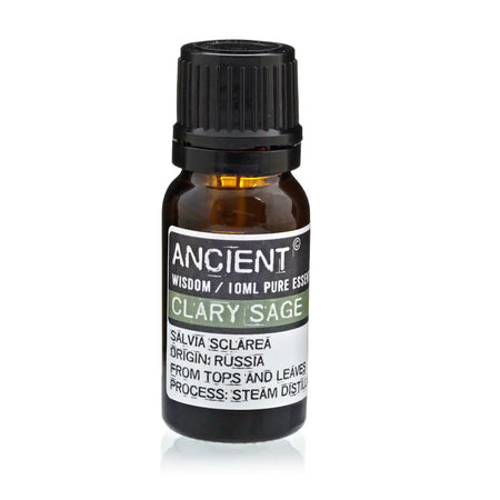A small amber glass bottle of clary sage essential oil with a black cap and white label with green accents