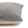 A square cotton cushion cover with a grey black and white fine herringbone weave fabric pattern