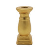 Classic gold ceramic candle holder with ornate design and textured finish made for holding candles