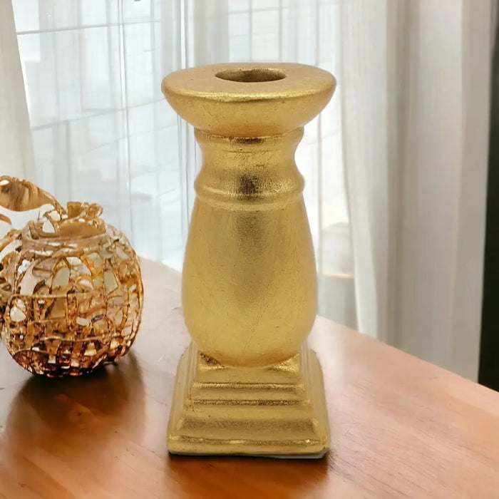 Classic gold ceramic candle holder with a textured metallic finish and square base for home decor use