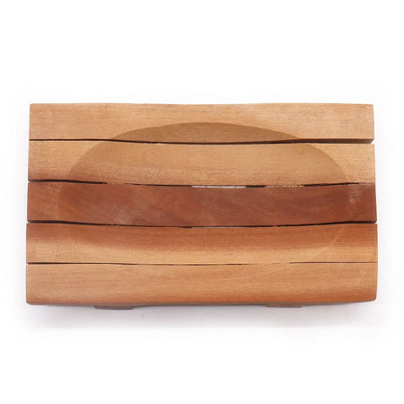 Rectangular naseberry wood soap dish with natural light brown finish and horizontal slats forming an oval recess