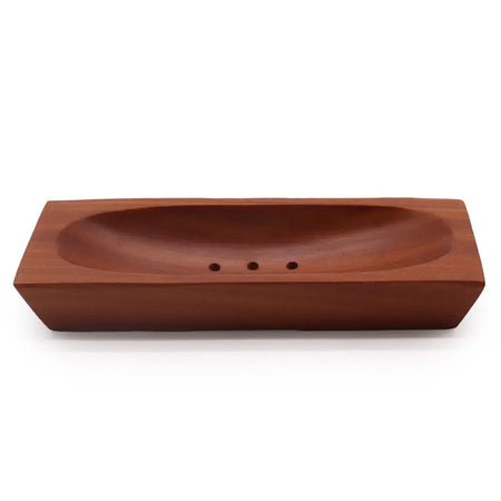 Rectangular soap dish made of rich brown naseberry wood with a smooth finish and three small drainage holes inside