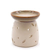 Beige ceramic oil burner with glazed top rim and leaf shaped cutouts called classic oil burner natural