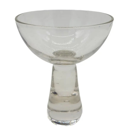 Clear glass ball candle and tealight holder shaped like a coupe glass with a slender stem and fluted base