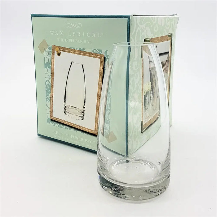Clear glass reed diffuser bottle with a sleek tapered design and sturdy base made of clear glass material