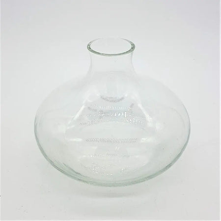 Clear glass reed diffuser bottle squat-shaped with subtle etched decorative patterns and a clear glass finish