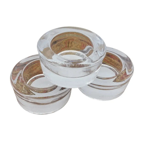Clear glass tealight holders with smooth rounded design and subtle reflections made of transparent glass tealight holders