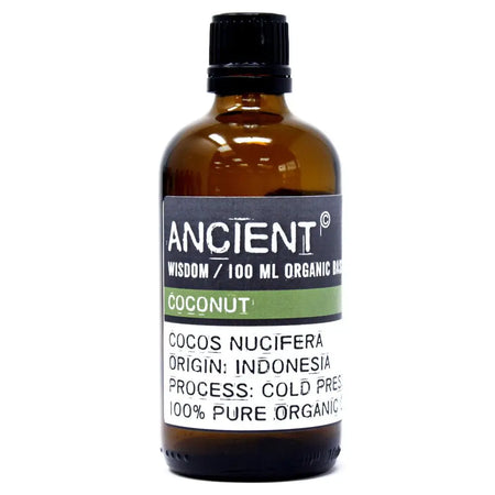 A dark amber glass bottle of ancient wisdom coconut organic base oil 100ml with allergen declarations for hair care
