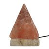 A usb himalayan salt lamp pyramid with a warm pinkish-orange hue and natural crystalline texture on a marble base