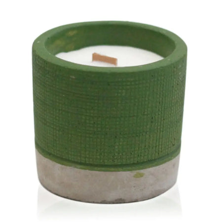 Green concrete candle pot with white wax interior and wooden wick in sea moss and herbs scent
