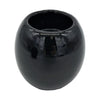 A sleek black ceramic tealight holder with a rounded bowl shape and smooth glossy surface