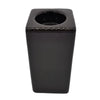 Black glossy ceramic tissue box with square shape and circular opening next to brown ceramic tealight holder tall