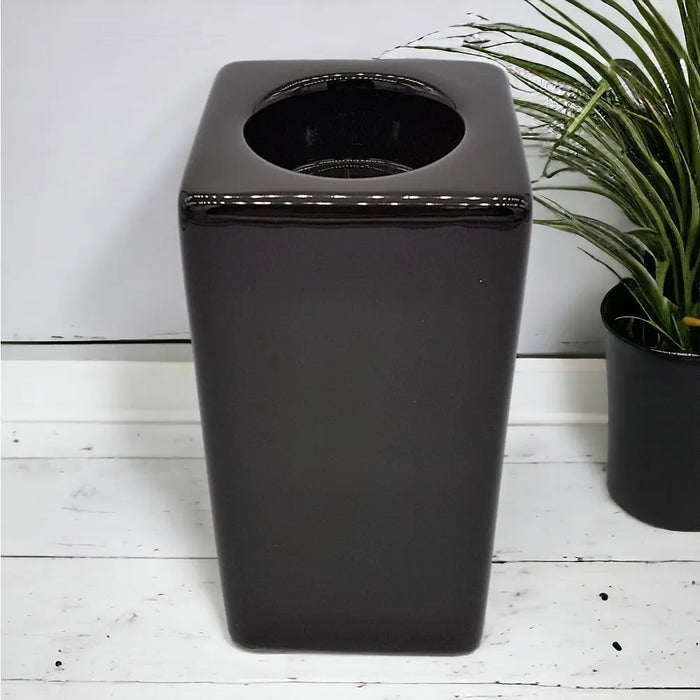 Contemporary brown square ceramic tealight holder tall with a black glossy square trash can featuring a circular top opening