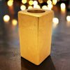 Golden rectangular ceramic tealight holder with textured surface and central opening 5cm square size