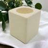 Contemporary ivory square ceramic tealight holder with a smooth glossy finish and rounded edges for candles