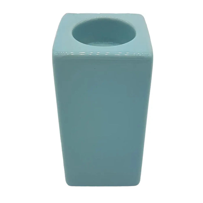A pale blue ceramic tealight holder with a matte finish square shape and rounded edges, high x 7cm model