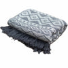 Gray and white geometric patterned cotton throw blanket with dark gray fringe for cozy comfort