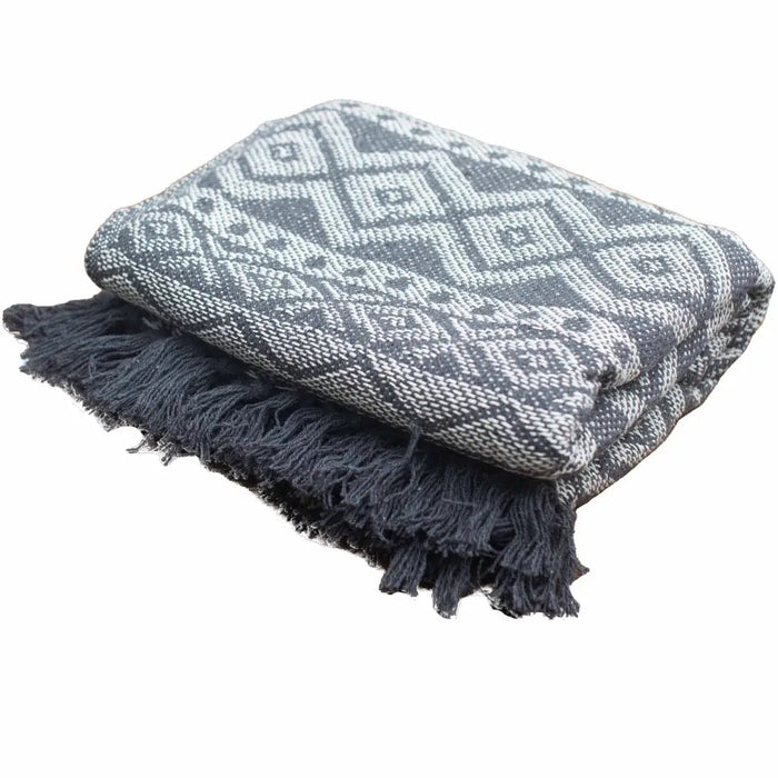 Gray and white geometric patterned cotton throw blanket with dark gray fringe for cozy comfort