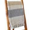 Cotton comfort throw blanket with handwoven cream beige and navy stripes and fringed edges for cozy use