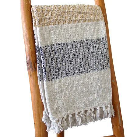 Cotton comfort throw blanket with handwoven cream beige and navy stripes and fringed edges for cozy use