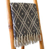 Cotton comfort throw with black and beige geometric pattern and fringe made from woven cotton material