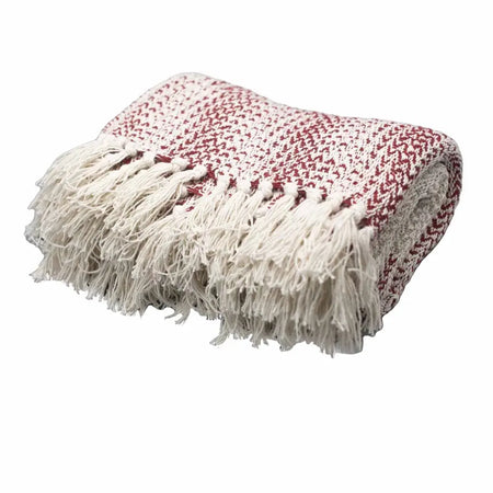 A cozy cotton throw blanket in cream and ruby with a speckled pattern and long off-white fringe