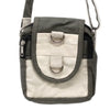 Cotton cross body bag in olive green and cream canvas with metal rings and zipper details for everyday use