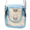 Light blue and cream cotton cross body bag with black zipper accents and silver hardware in a casual style