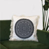Cotton cushion cover with a black traditional mandala design on white fabric and frayed edges