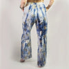 Blue and white tie-dye cotton lounge pants with wide legs and gold block print inspired by nomad sari style