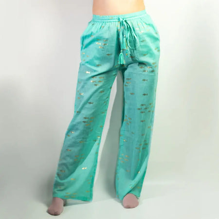 Turquoise cotton lounge pants with wide legs drawstring waist and gold fish embroidery from nomad sari collection