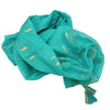 A turquoise cotton pareo with gold fish motifs and a matching tassel for lightweight beach cover-up or scarf use